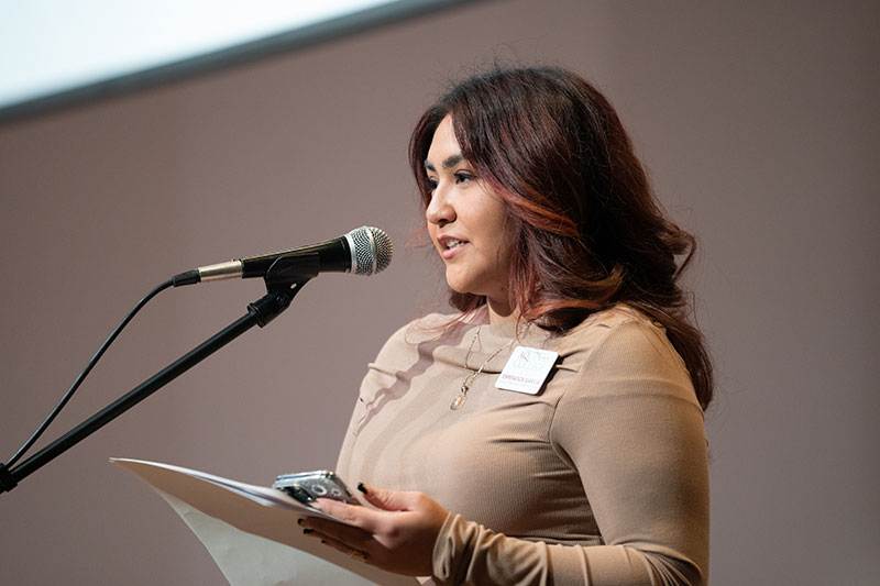 Esperanza Garcia speaks at a microphone