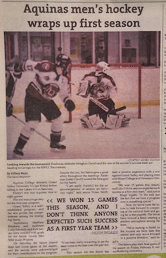 News clip with an Aquinas Hockey Player facing the goalie of the opposing team on the ice. Headline: Aquinas men's hockey wraps up first season. Large text in the body reads &quot;We Won 15 Games&quot;