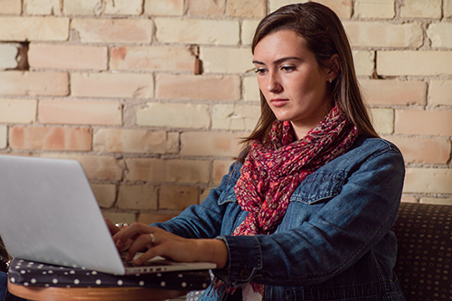 student at laptop working 