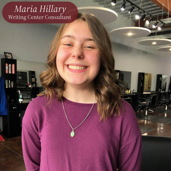 Picture of a girl with shoulder length hair, wearing a purple shirt, in a hair salon. Text reading: Maria Hillary, Writing Center Consultant.