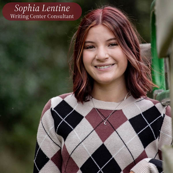 Picture of a good with shoulder length, maroon hair, outside. Text reading: Sophia Lentine, Writing Center Consultant.