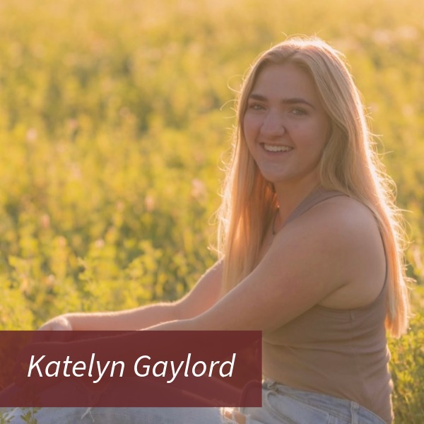 Picture of a girl with long, blonde hair, in a field. Text reading: Katelyn Gaylord.