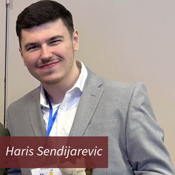 Headshot of a boy with short, dark hair, in front of a brown backdrop. Text reading: Haris Sendijarevic, Writing Center Consultant, Archivist.