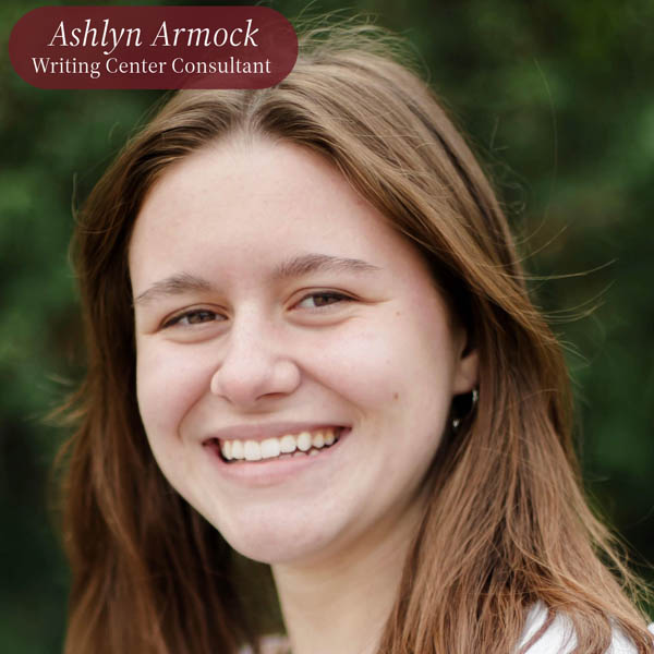 Headshot of a girl with shoulder length, light brown hair, standing outside. Text reading: Ashlyn Armock, Writing Center Consultant.