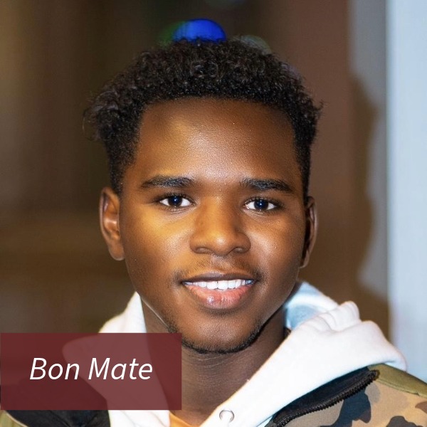 Headshot of a boy with short, dark hair and facial hair. Text reading: Bon Mate, Writing Center Consultant.