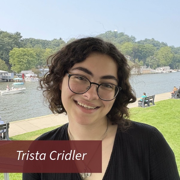 Picture of a girl outside with dark chin length hair. Text reading: Trista Cridler
