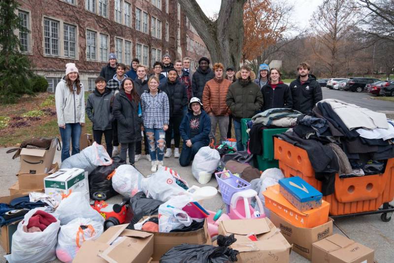 Aquinas College students donate three truckloads of clothes and medical goods to Mel Trotter Ministries