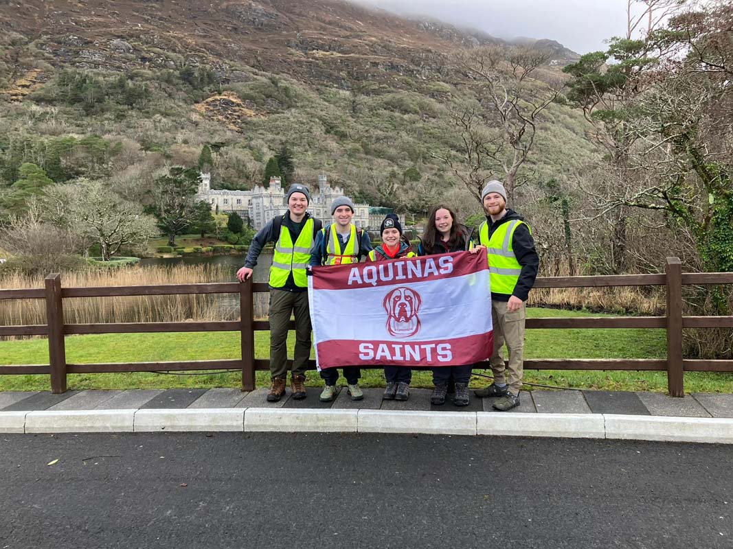 Students posing with Aquinas flag in Ireland