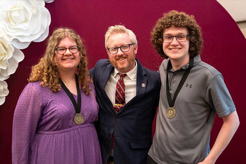 Professor and graduates 