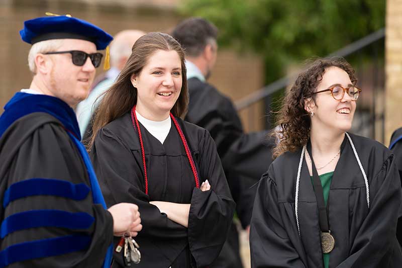 Professor and graduates